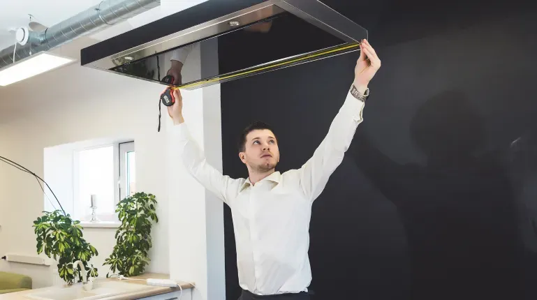 guy-measuring-vent-hood